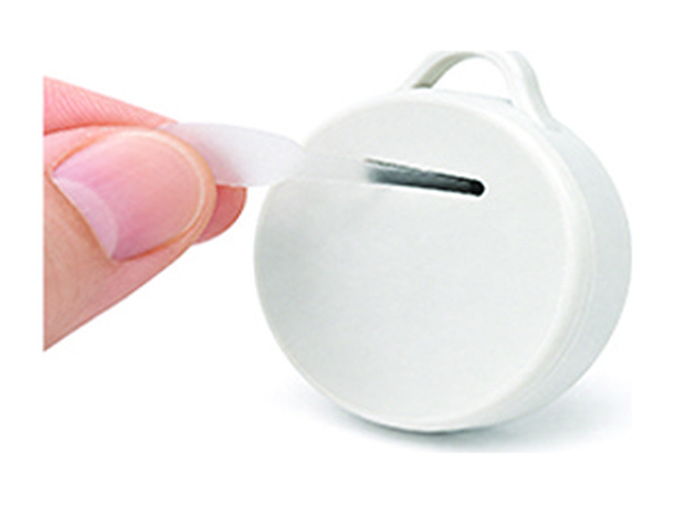 Pulling the plastic battery tab out of the device tag